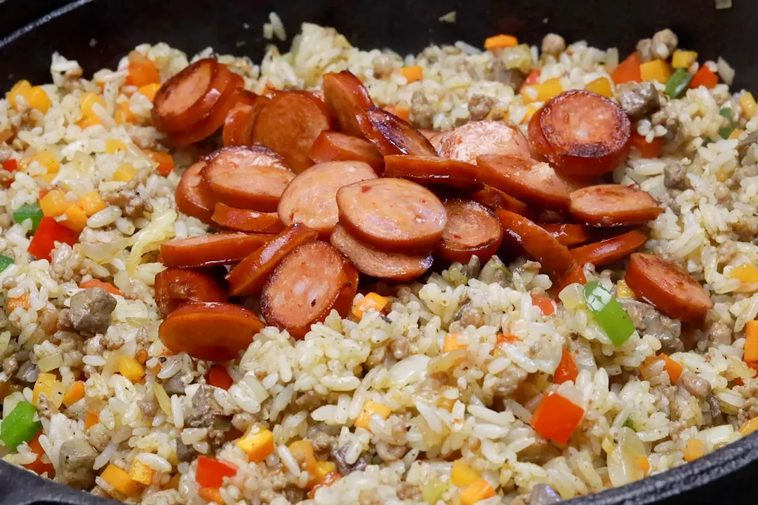 sausage slices bed on cooked rice