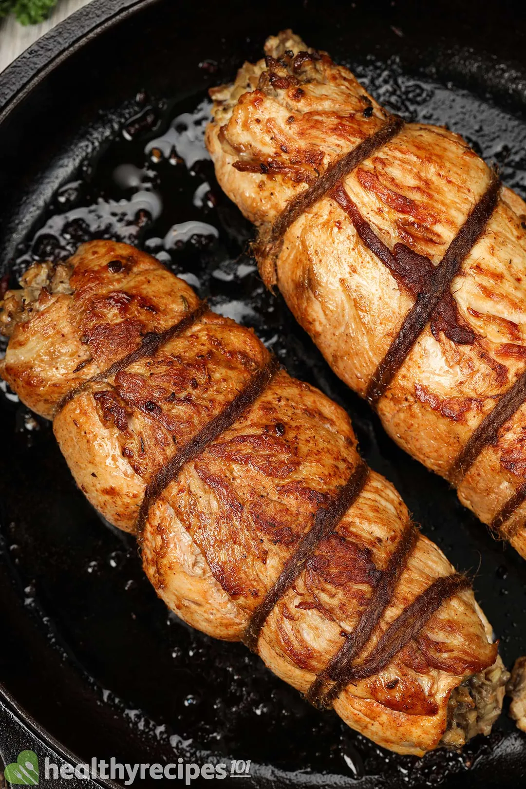 close shot of two cooked stuffed pork loin