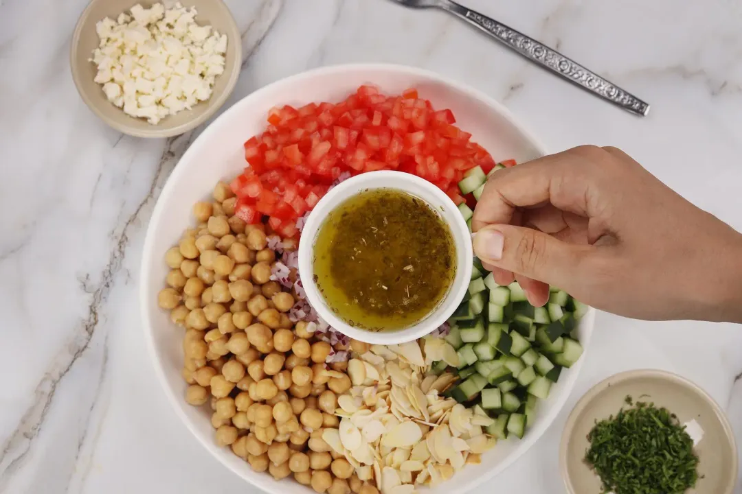 Dress chickpea salad with the vinaigrette