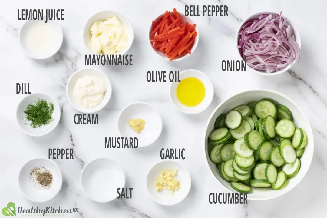 Ingredients for cucumber salad: sliced cucumbers, onion, red pepper, and mayo dressing ingredients
