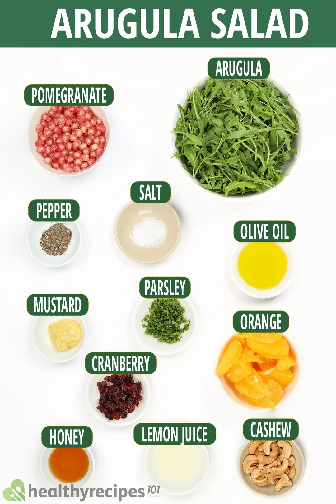 Ingredients for Arugula Salad, including a bowl of fresh Arugula, pomegranate seeds, orange segments, and other ingredients.