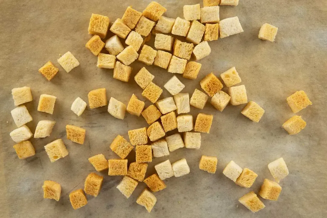 Crunchy croutons on a baking sheet.