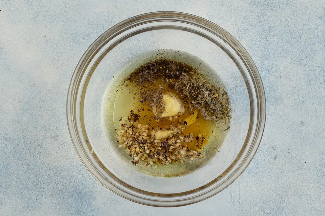 a glass bowl of dressing