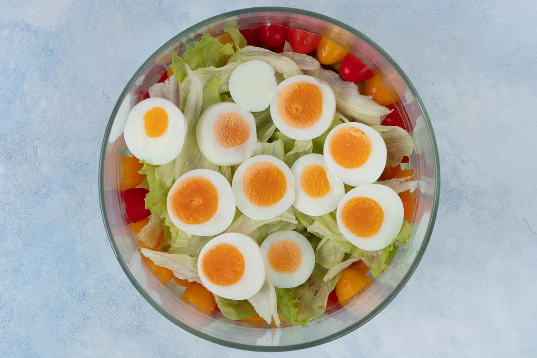 half eggs on a salad bowl