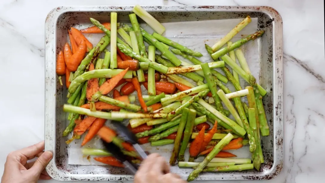 Bake the vegetables for permesan crusted salmon