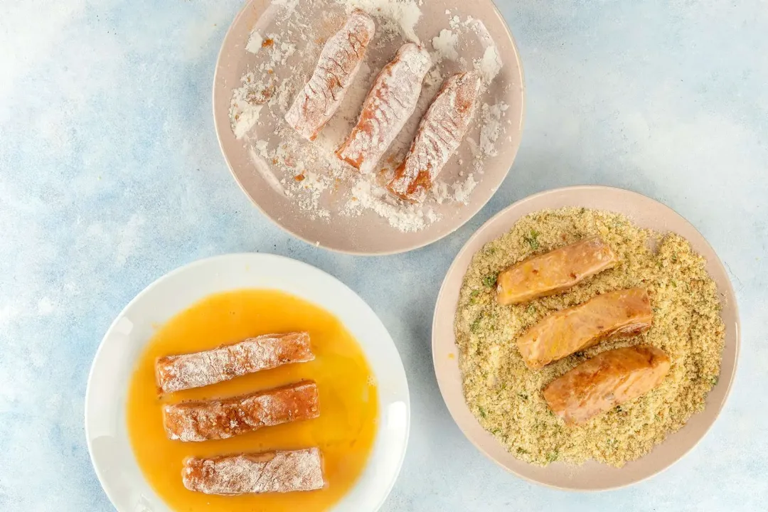 Coat each fish stick in flour egg wash and breadcrumbs
