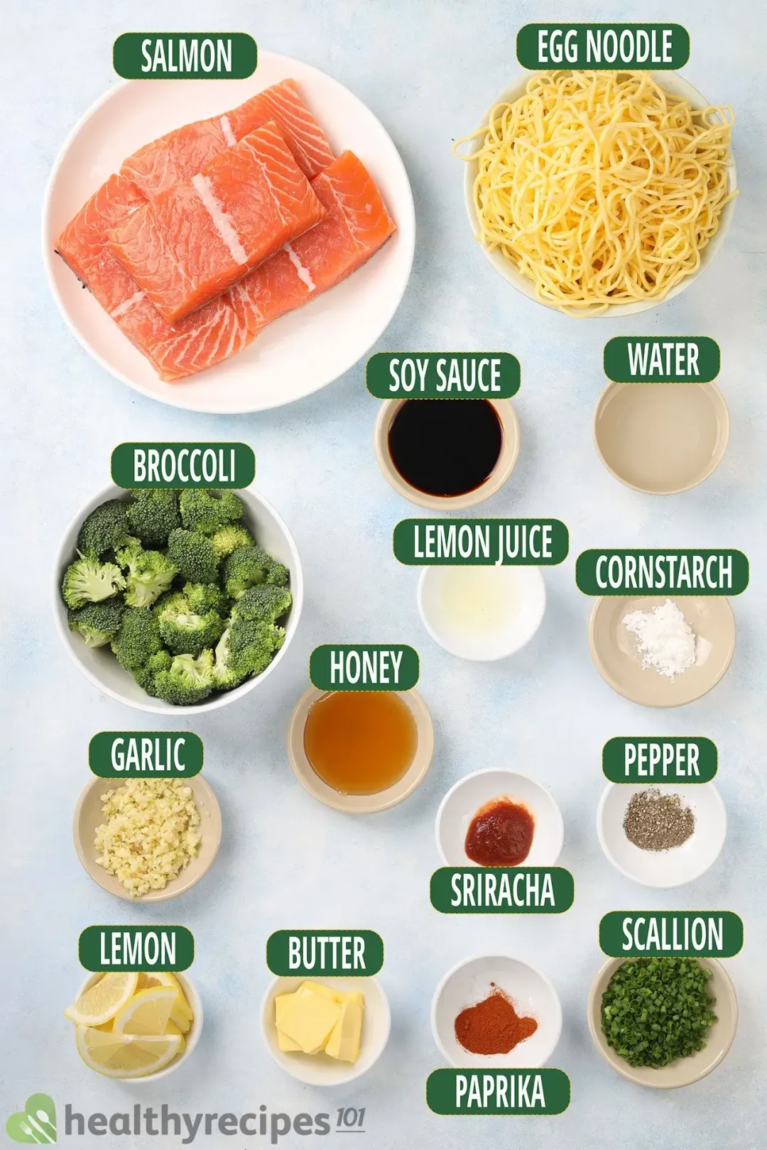 Ingredients for this honey garlic salmon: boneless salmon, broccoli, egg noodles, lemon, garlic, scallion, butter, soy sauce, honey, lemon juice, sriracha, paprika, constarch, ground black pepper, and water.