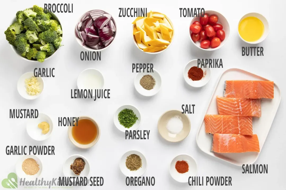 A rectangle plate containing four salmon fillets, a bowl of broccoli florets, a bowl of cherry tomatoes, and various condiments