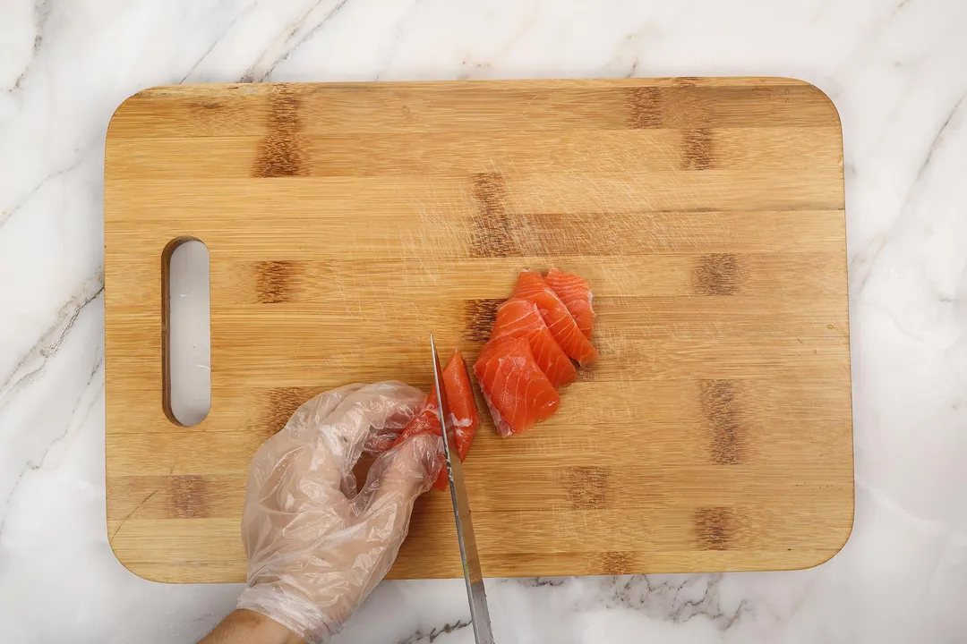 cut salmon fillet on a cutting board