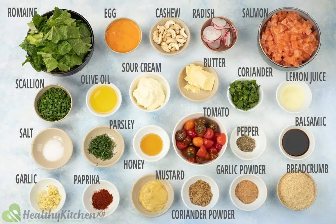 The ingredients include salmon cubes, chopped romaine lettuce, tomatoes, egg wash, cashew, sour cream, lemon juice, olive oil, bread crumbs, and other herbs and spices.