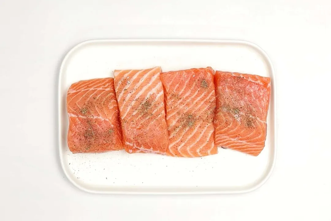 four salmon fillet season in a plate