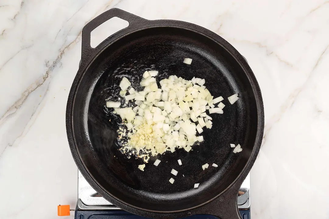 saute onion and garlic on a cast iron skillet