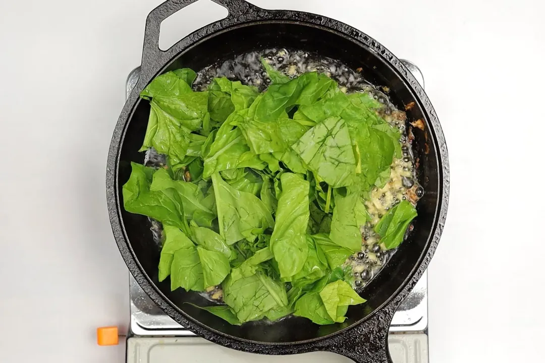 step 3 Stir in garlic and spinach with butter tuscan butter salmon