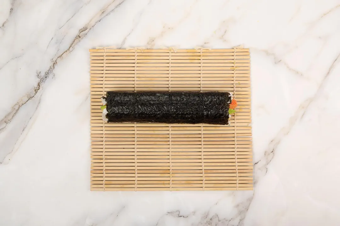 a sushi roll on a cutting board