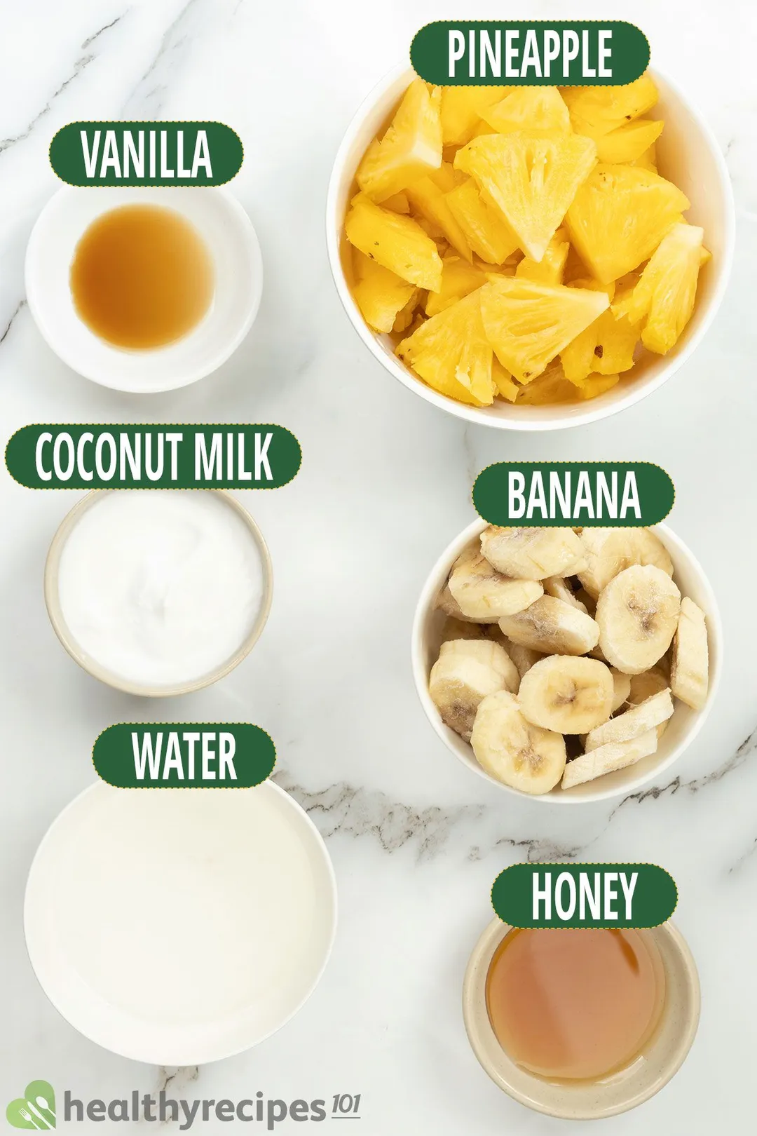 Pineapple Smoothie ingredients: pineapple slices, banana slices, honey, milk