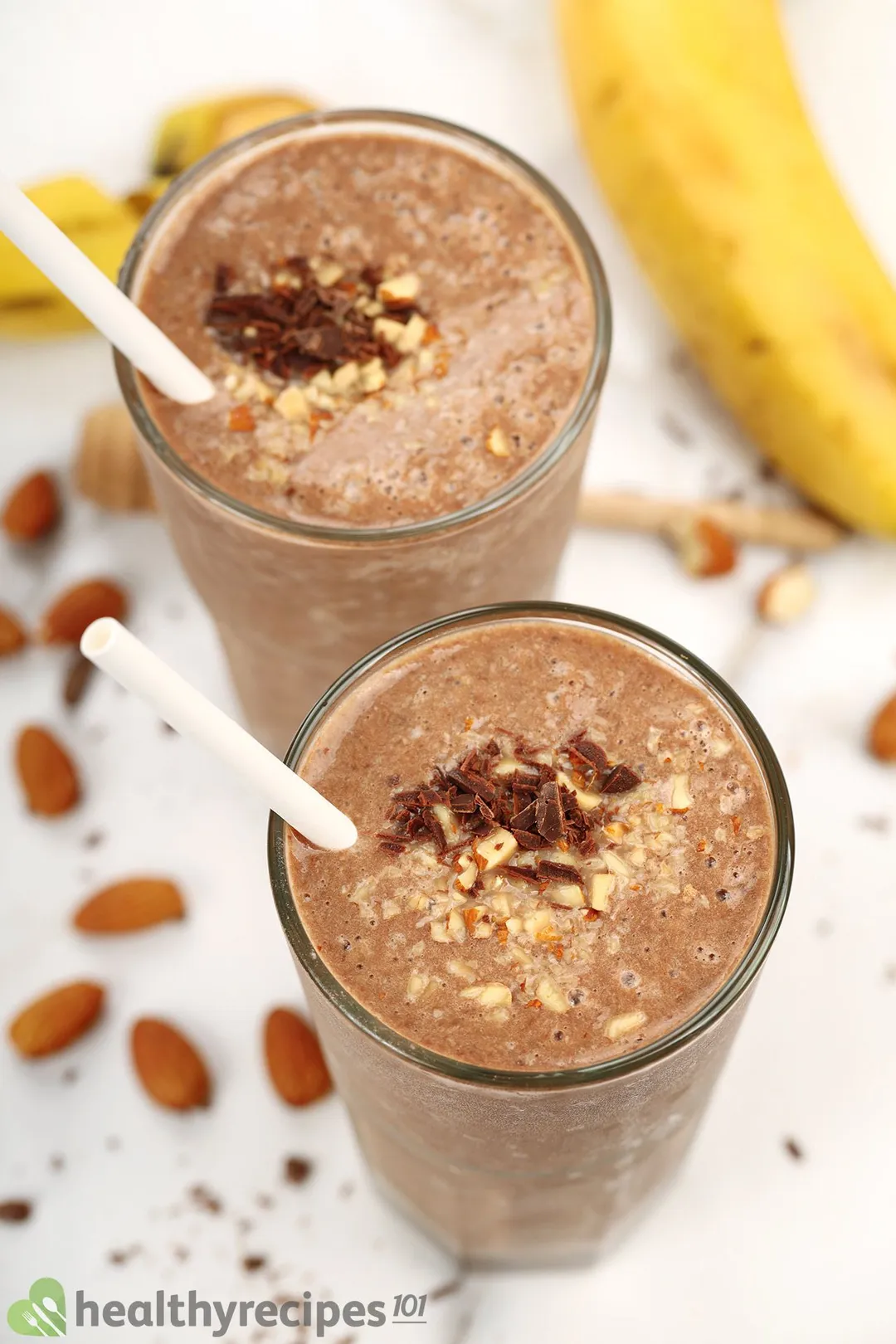 Two glasses of chocolate peanut butter banana smoothie.