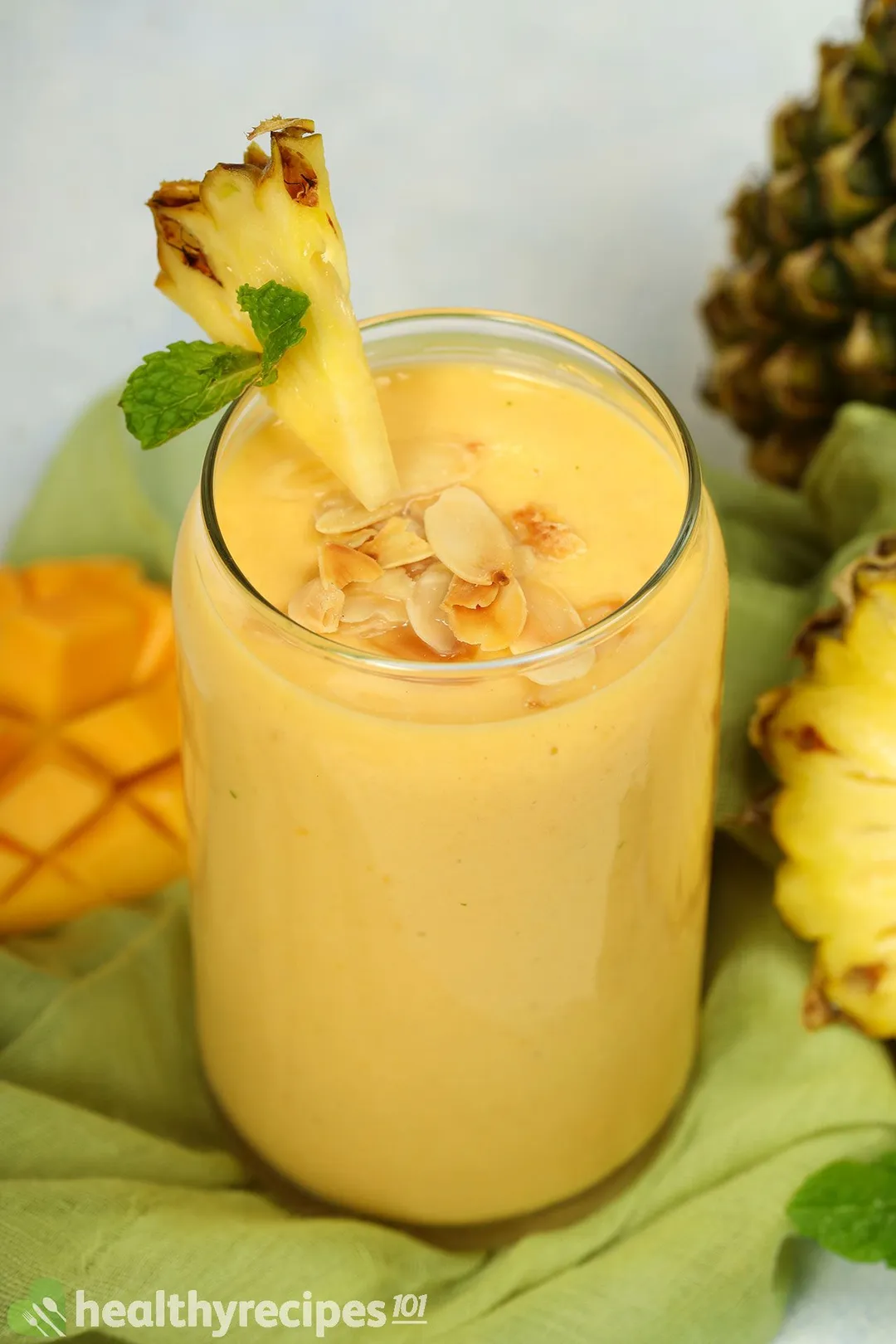 a glass of mango pineapple smoothie