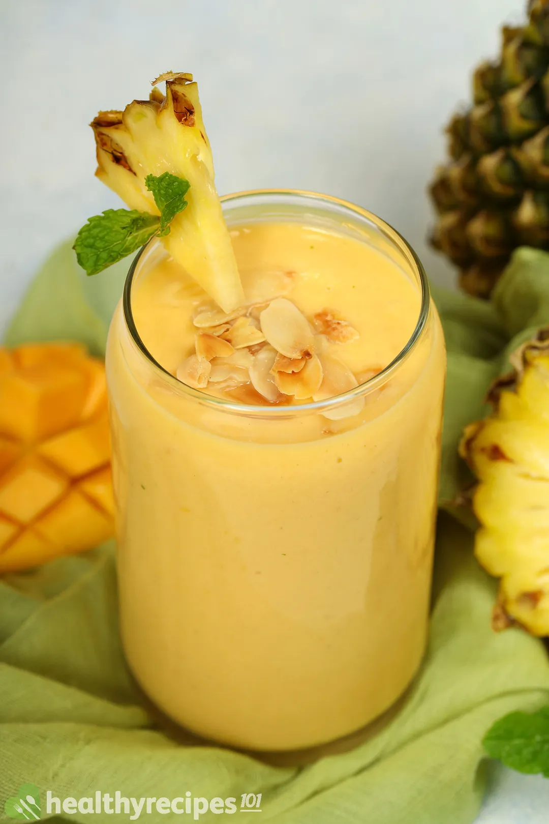 a glass of mango pineapple smoothie
