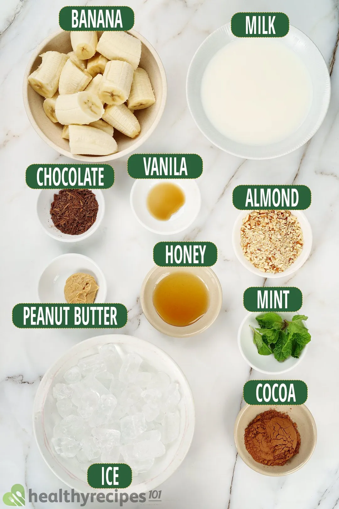 Ingredients for chocolate peanut butter banana smoothie, including sliced and peeled bananas, minced chocolate, cocoa powder, and other ingredients.