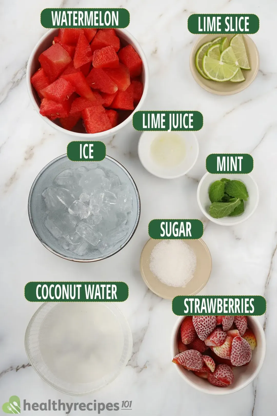 Ingredients for this watermelon mojito smoothie: cubed watermelon, lime slices, lime juice, frozen strawberries, coconut water, mint leaves, sugar, and ice