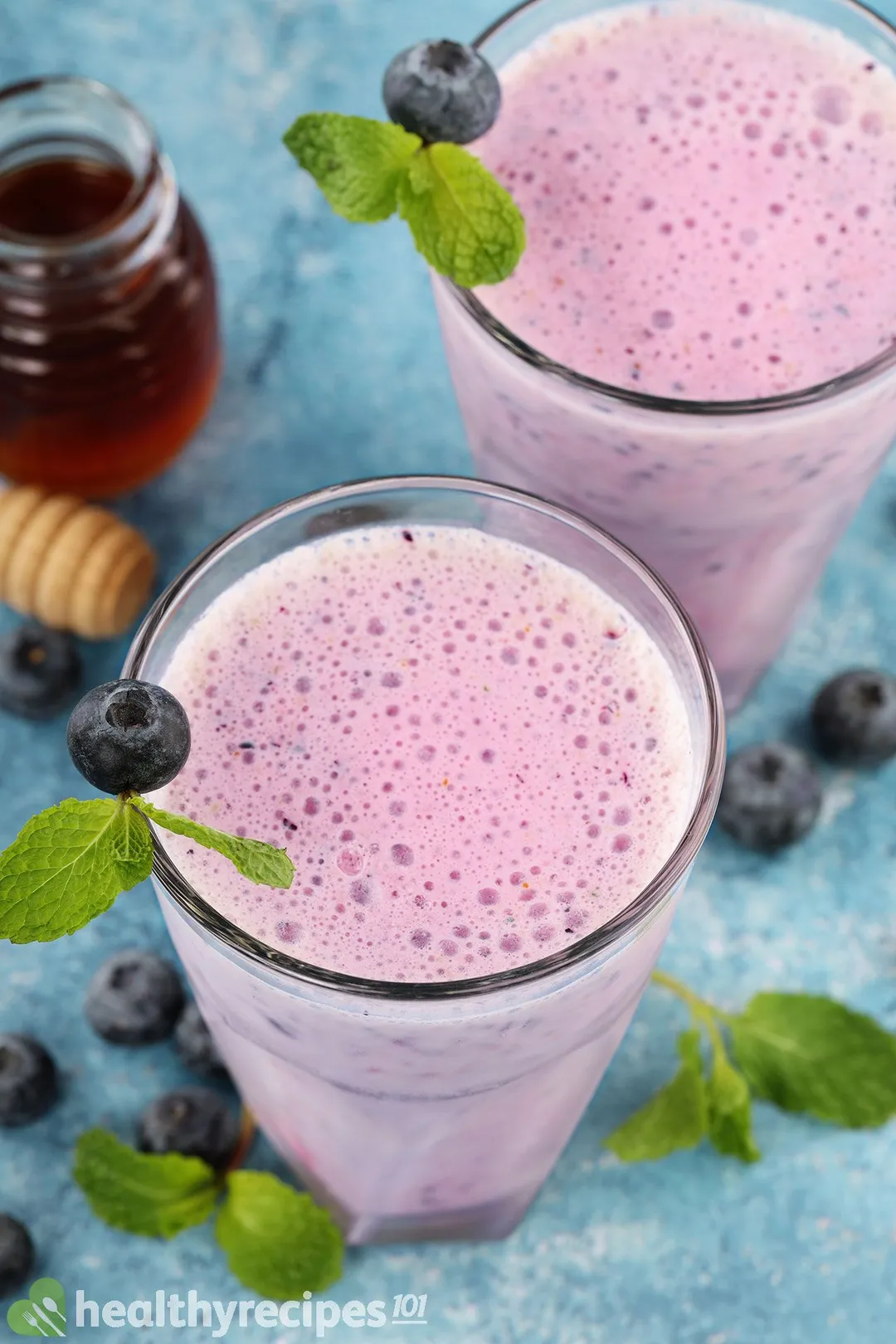 top view of two glasses of blueberry yogurt smoothie