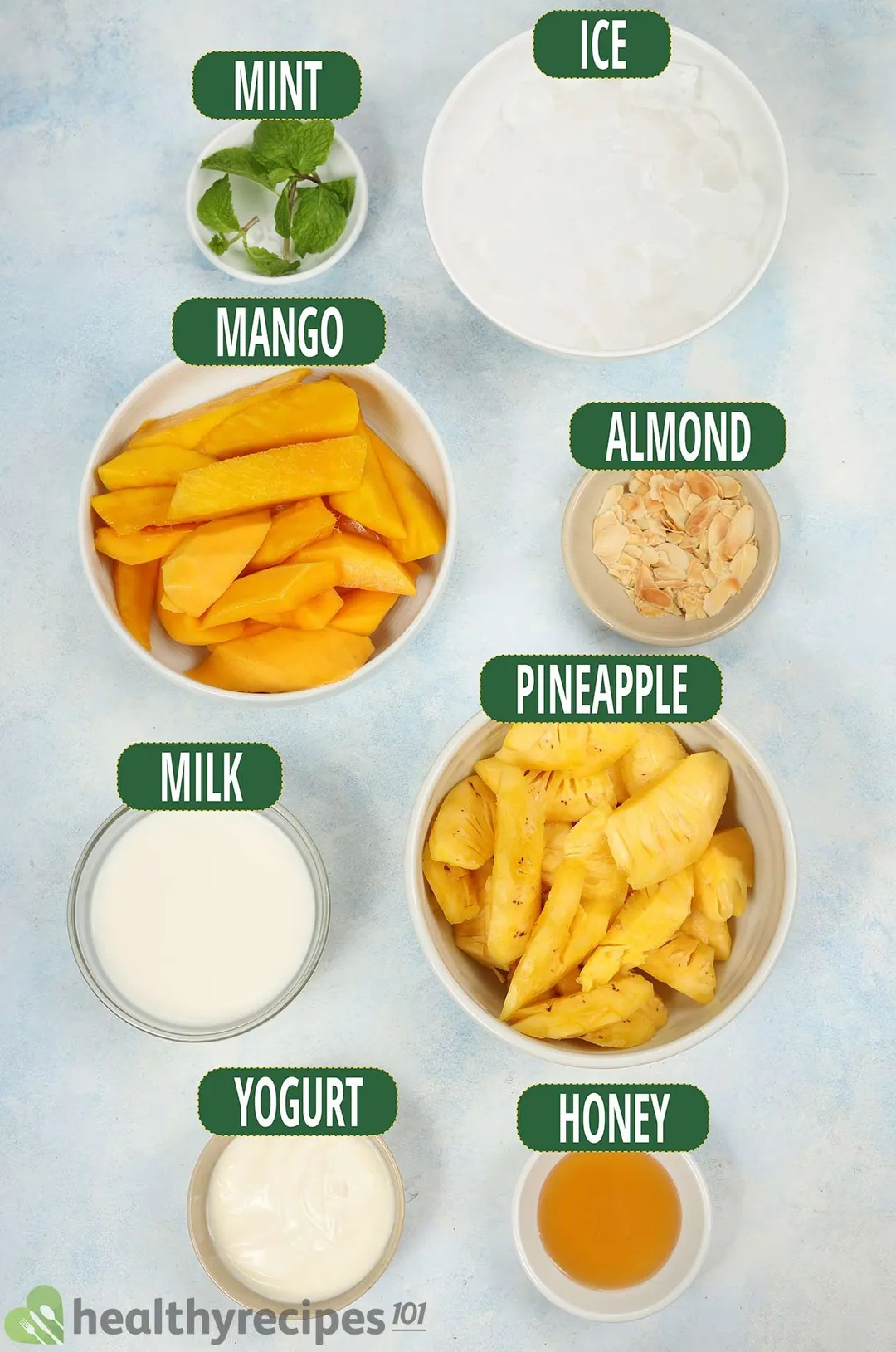 ingredients bowls for mango pineapple smoothie