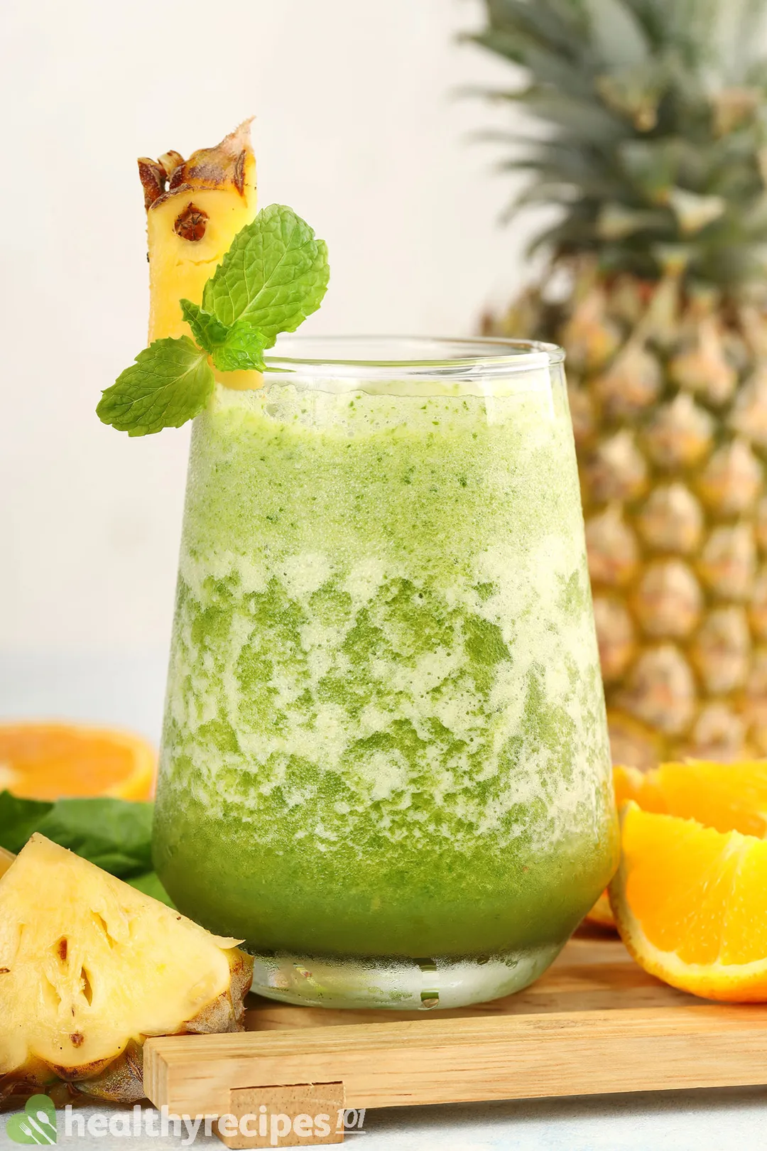 a glass of pineapple spinach smoothie