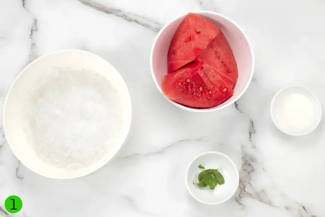Ingredients of the smoothie: ice, seedless watermelon, mint, and sugar