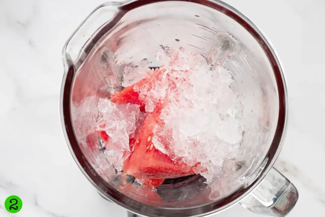 Watermelon and ice in a blender seen from the top