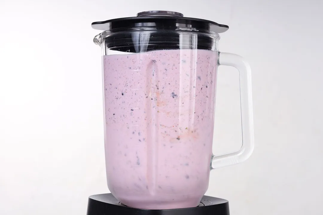 a blender pitcher full of smoothie