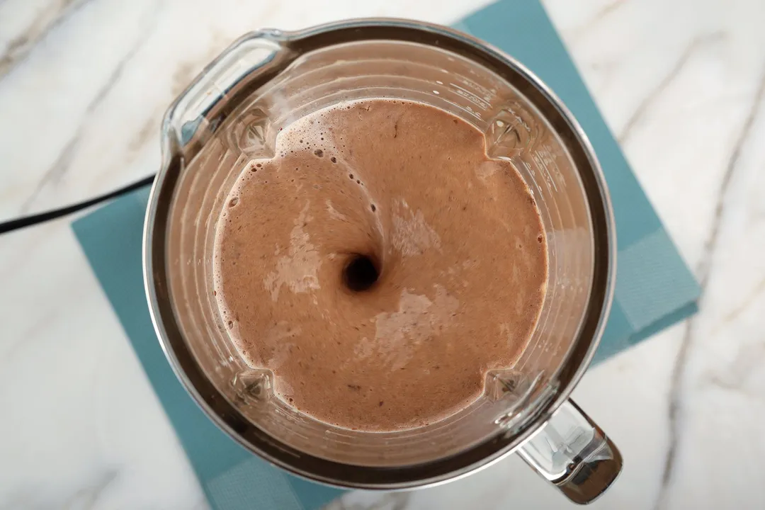 top view of Chocolate Banana Smoothie blending in a blender