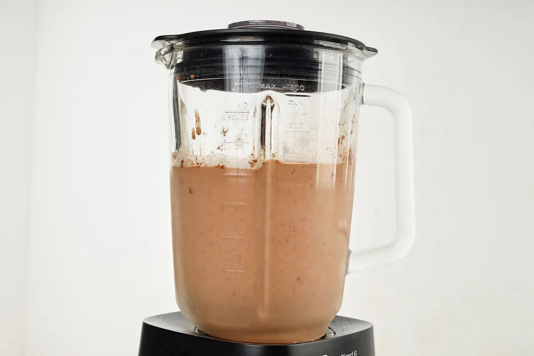 front shot of blender pitcher of chocolate smoothie