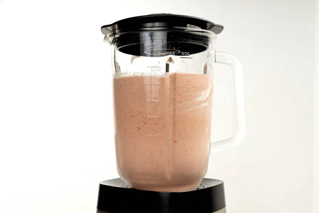 a front shot of blender pitcher with chocolate smoothie in it
