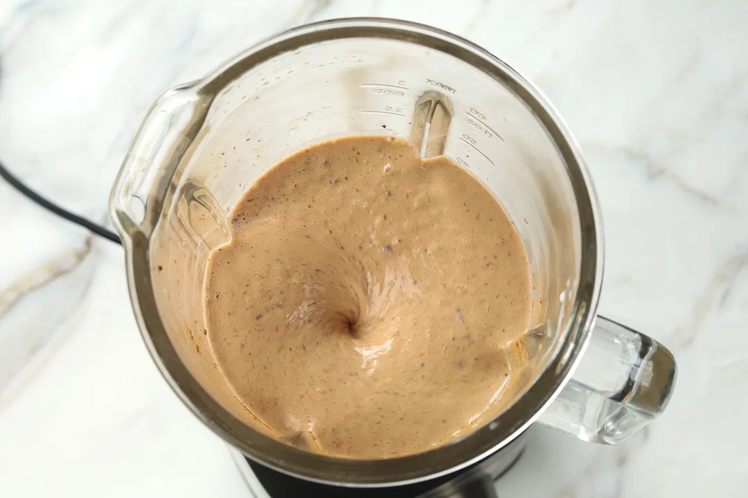 blending coffee banana smoothie in a blender