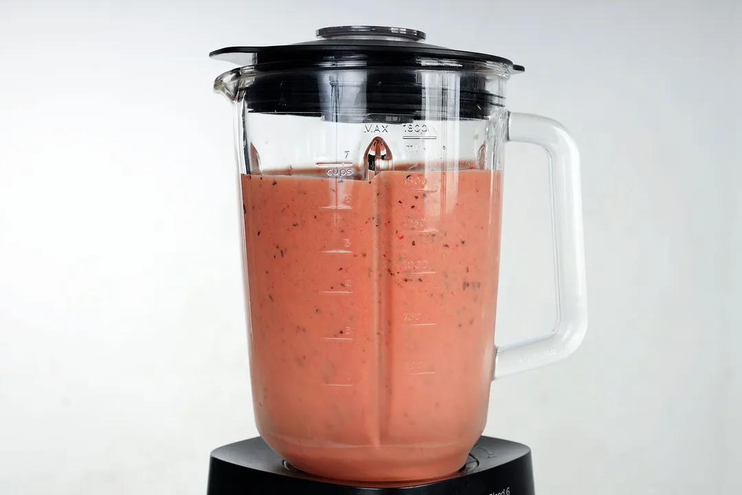 a blender of mango berry smoothie