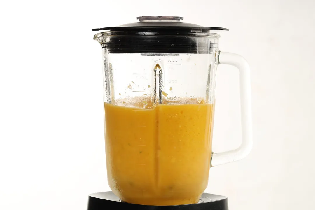 a blender pitcher of Mango Ginger Smoothie