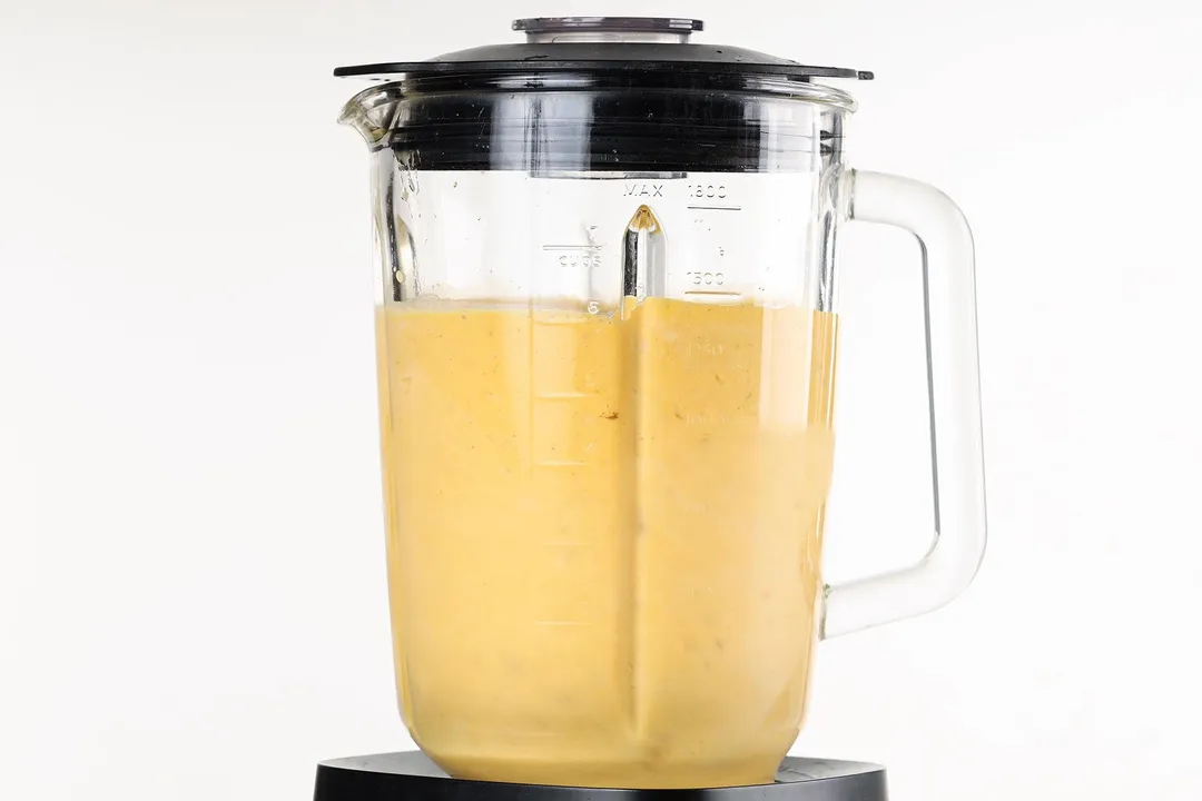 front shot of a blender pitcher of pumpkin smoothie
