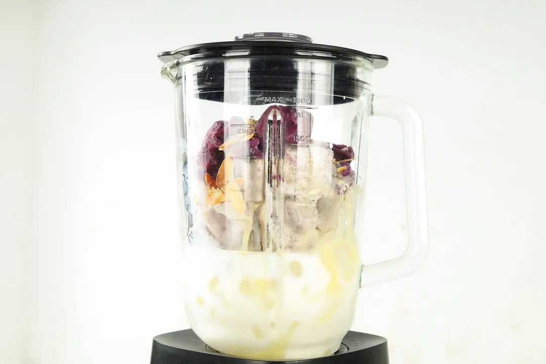 taro, sweet potato, almond sliced, milk and ice in a blender pitcher