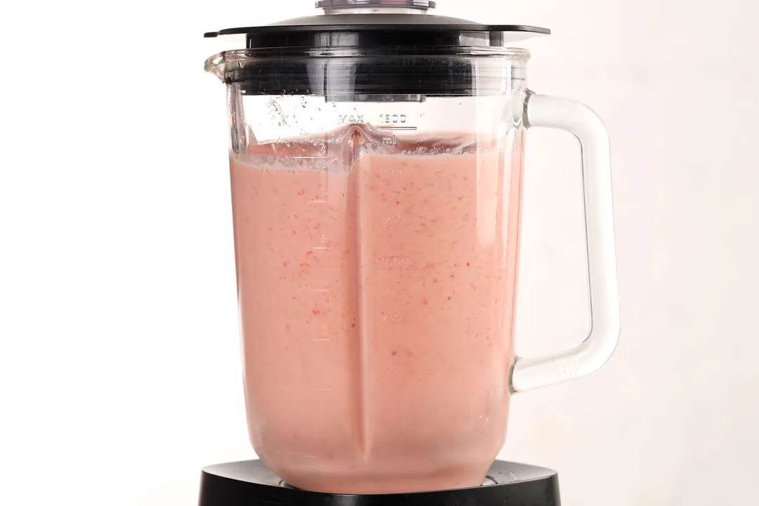 a front shot of watermelon banana smoothie in a blender