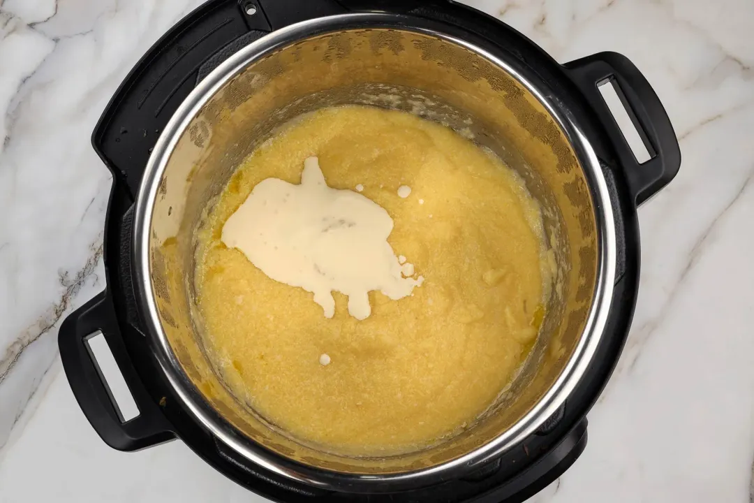 Add heavy cream to polenta