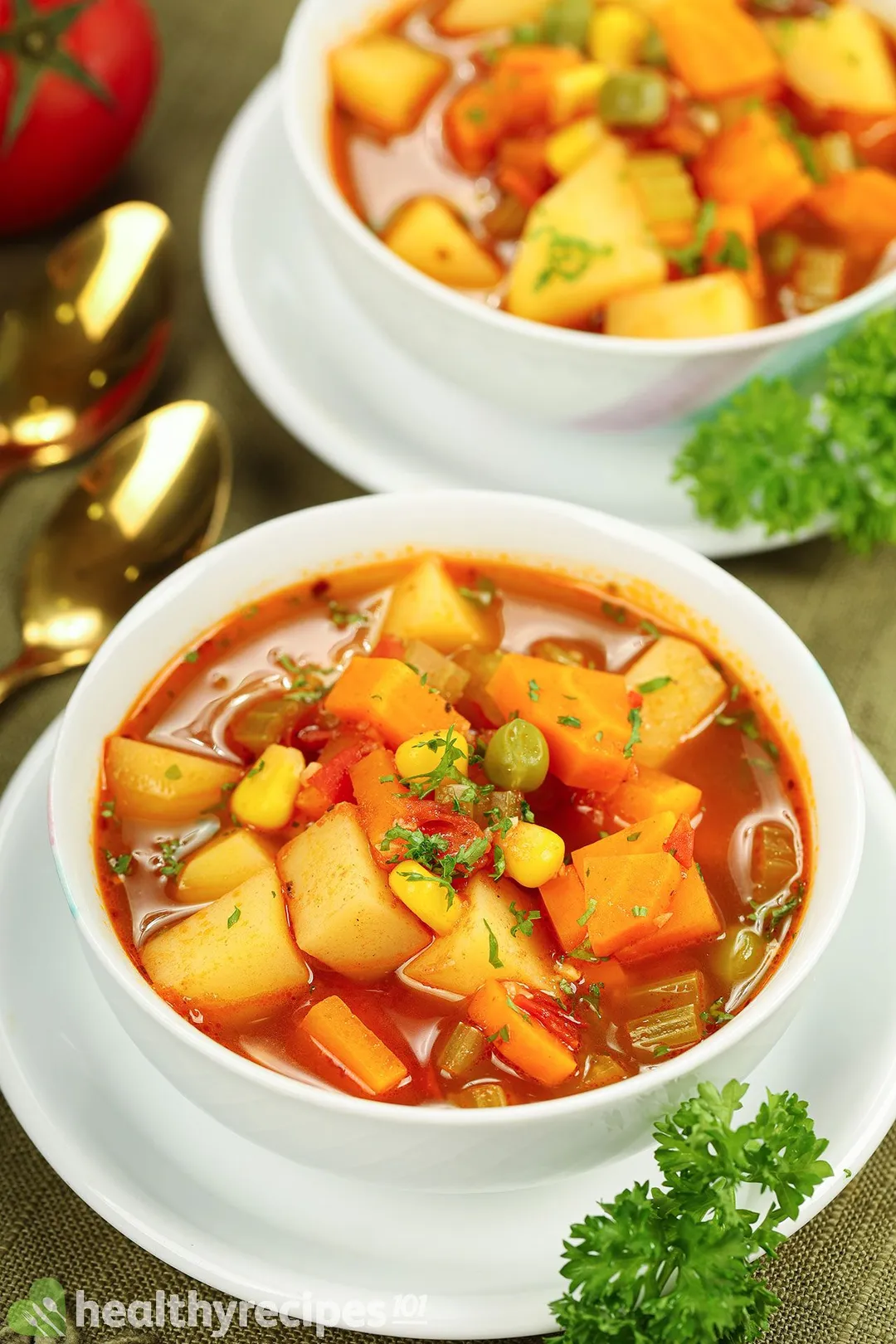 two bowl of vegetable soup on plate