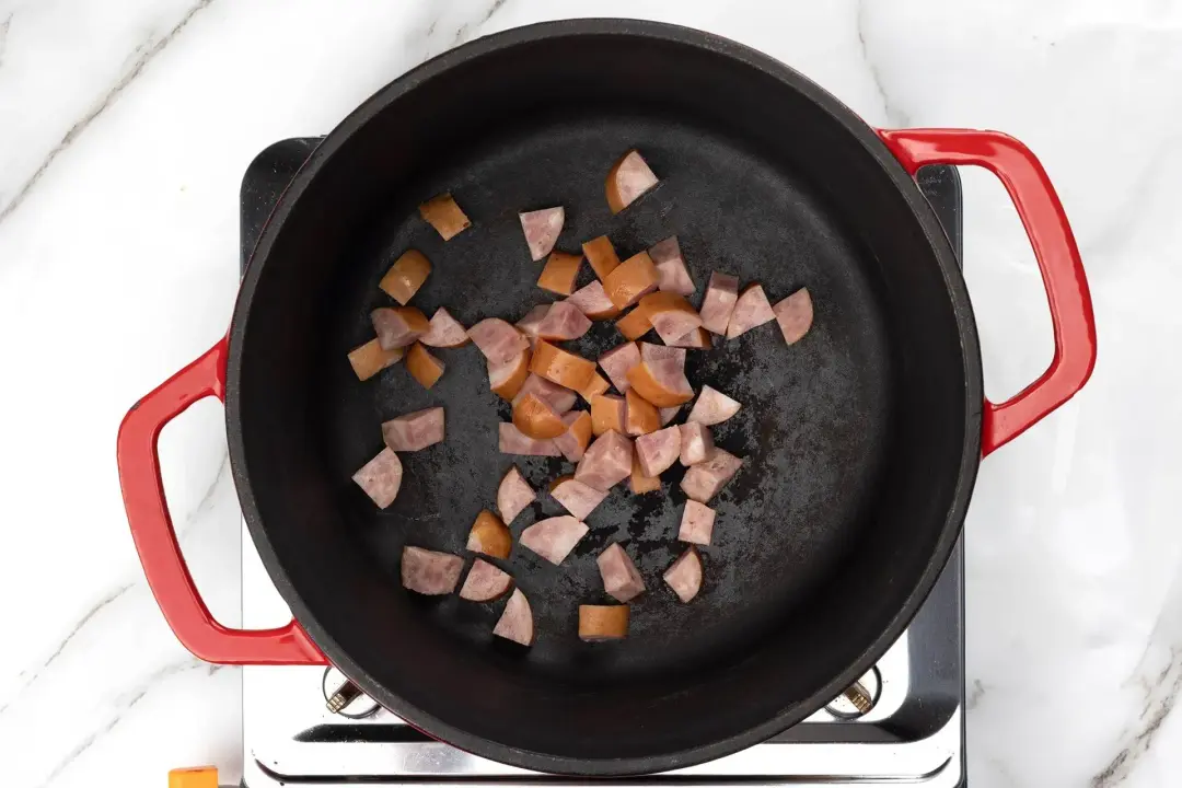 Sear the sausage in olive oil in a cast iron skillet