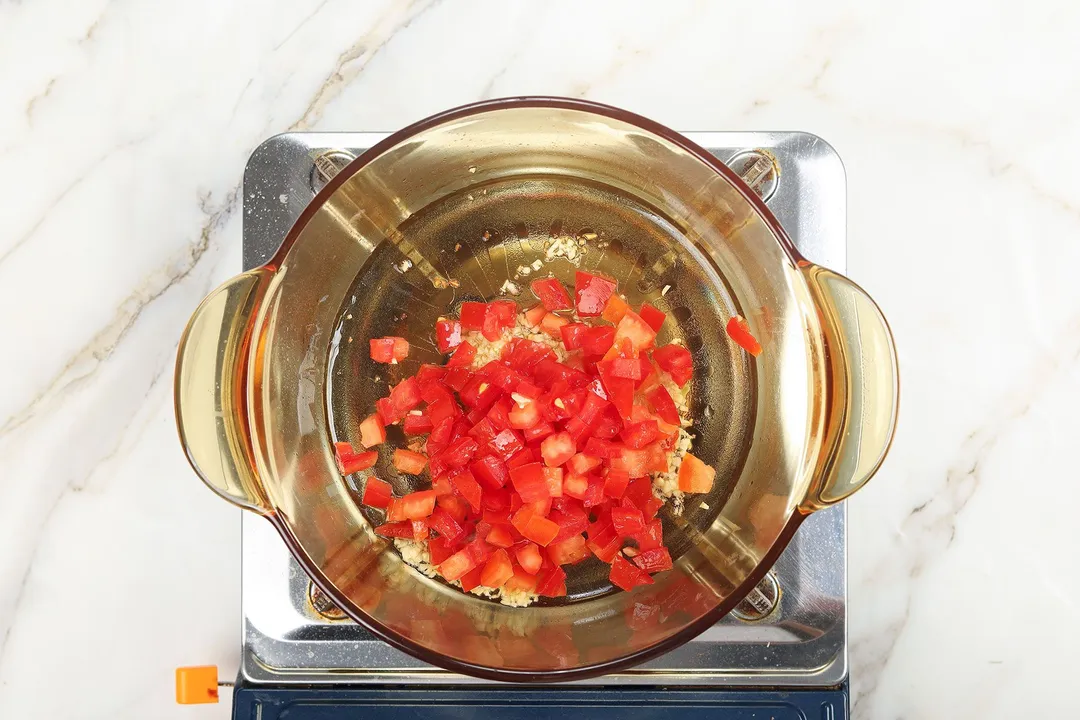 cooking diced tomato in a pot