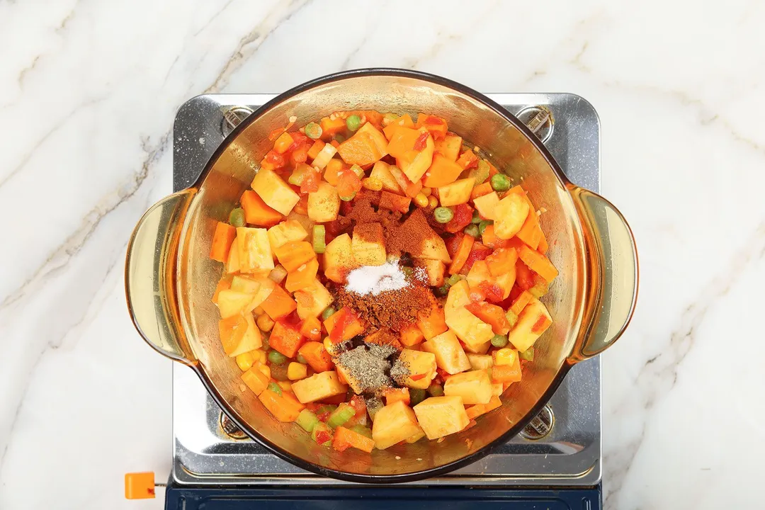 seasoning a vegetable cooking in a pot