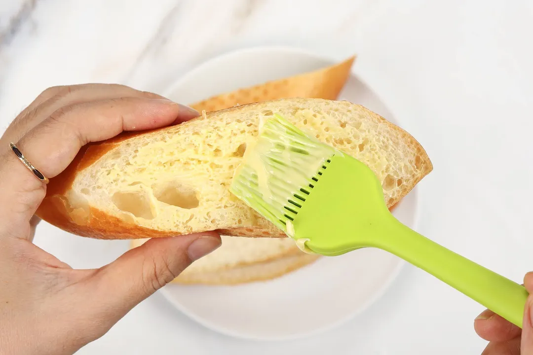 spread butter on bread slice