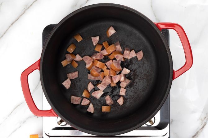 Sear the sausage in olive oil in a cast-iron skillet