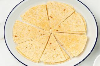 step 3: Brush corn tortillas with oil and cut them into small triangles.