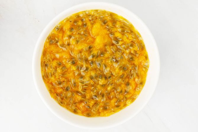 Cut the passion fruit pulp out into a bowl
