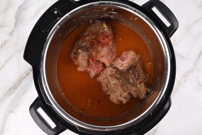 Add broth and pressure-cook the beef