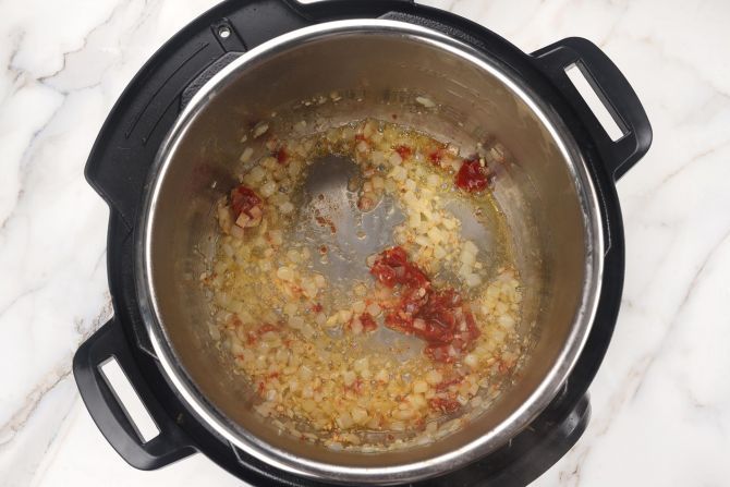 step 2: Add tomato paste.